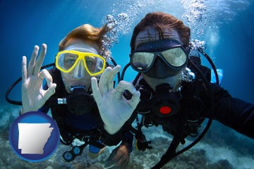 couple enjoying a scuba diving tour - with Arkansas icon