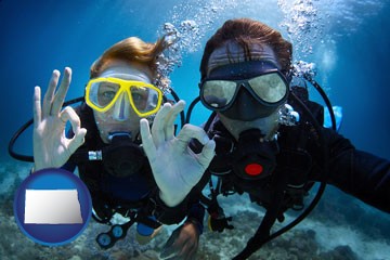 couple enjoying a scuba diving tour - with North Dakota icon