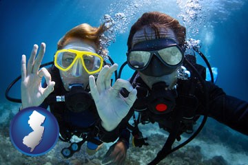 couple enjoying a scuba diving tour - with New Jersey icon