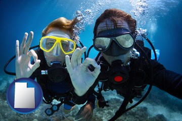 couple enjoying a scuba diving tour - with Utah icon